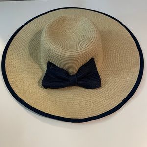 NEW Floppy Hat. Navy blue trim and now on the back. One size.